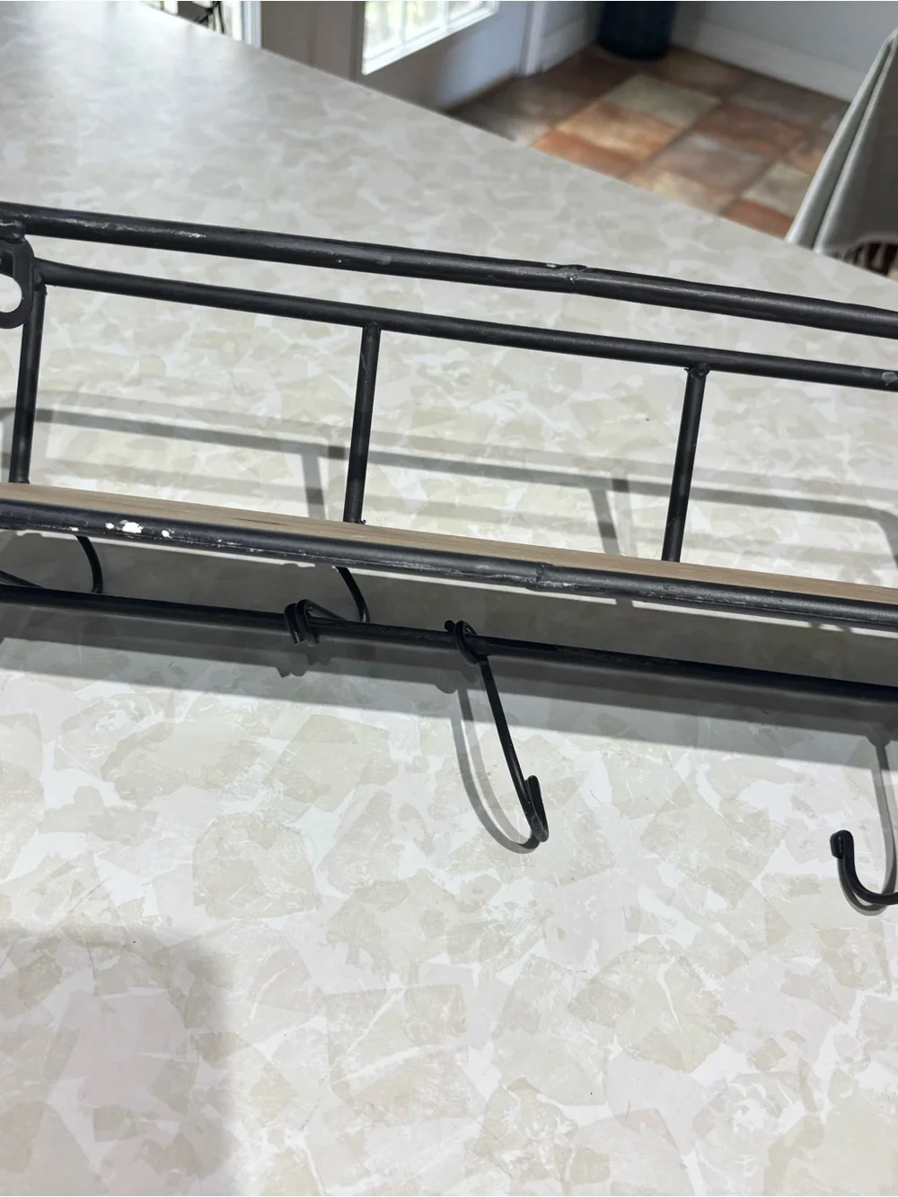 Rustic Black Metal Wall Shelf with Hooks and Wood Accent